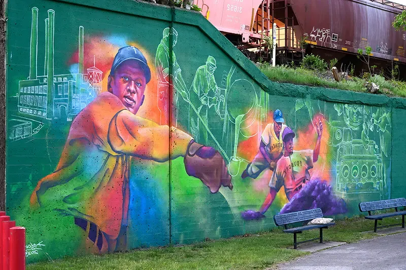 Spray painted mural on a wall near the ballpark.